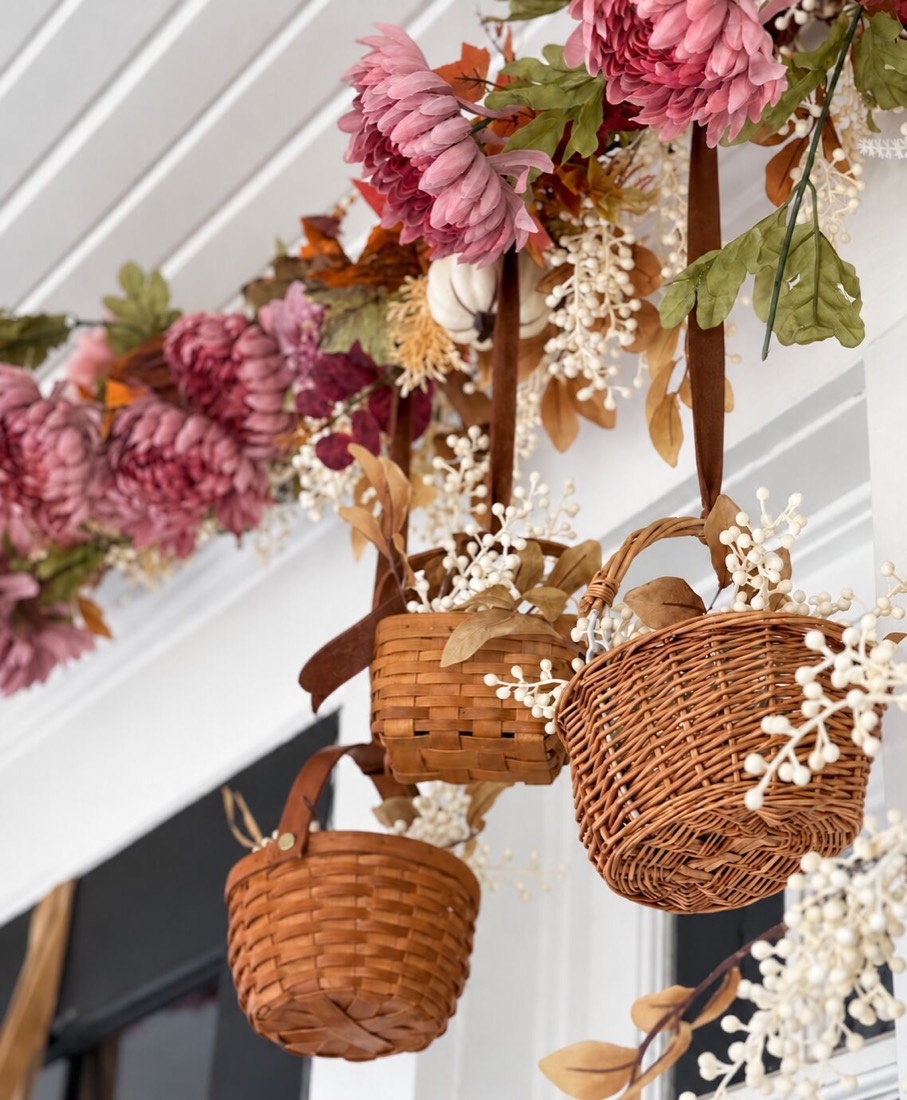 Purple and Pink and Orange Front Porch Decorated With Pumpkins